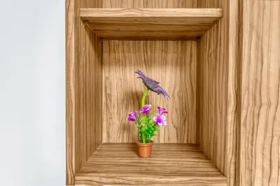 a vase with purple flowers in a wooden box at super Luxurious Apartment Downtown Dubai Mall burj khalifa DIFC in Dubai
