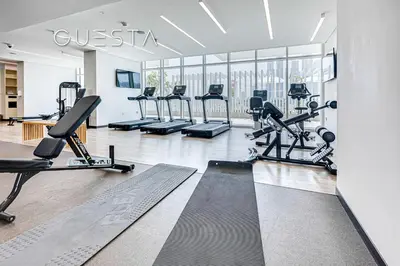 a gym with treadmills and cardio equipment in a building at Emaar Beachfront - Sunrise Bay Tower 1, Dubai Marina in Dubai
