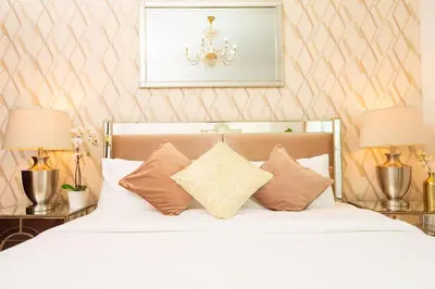 a bedroom with a bed with white sheets and pillows at Elite Royal Apartment - Sky Series - Best Burj Khalifa & Fountain View - High Floor - Visionary in Dubai