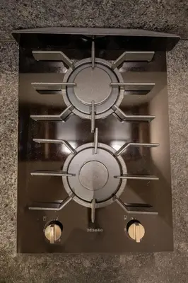 an overhead view of a stove top with lights at Brand New Designer Studio - Urban Retreat in JVC in Dubai