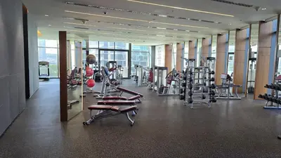 a gym with a bunch of treadms and machines at Luxury 1BR Downtown Dubai Skyline & Sea View in Dubai