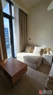 a living room with a couch and a coffee table at EGATE - Studio - 2nd Floor with Balcony - Dubai - 33-212 in Dubai