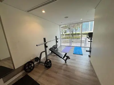 a room with a gym with a treadmill and a treadmill at Luxury2BR Canal View Free parking & water Downtown in Dubai