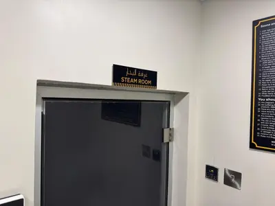 a sign above a door with a sign above it at Luxury2BR Canal View Free parking & water Downtown in Dubai