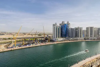 a view of a city with a river and buildings at Daniels Studio at Marasi Drive with Canal View in Dubai
