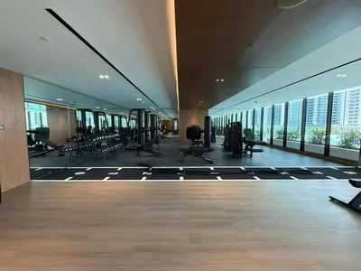 a gym with treadmills and chairs in a building at Daniels Studio at Marasi Drive with Canal View in Dubai