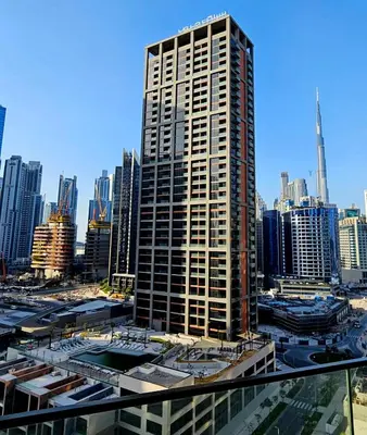 a tall building in the middle of a city at Luxury Fully Furnished One Bedroom in Dubai