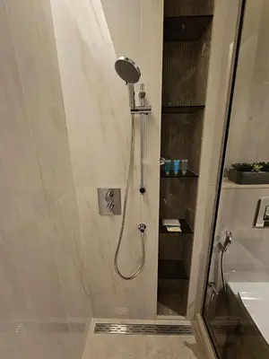 a shower with a shower head in a bathroom at Luxury Fully Furnished One Bedroom in Dubai