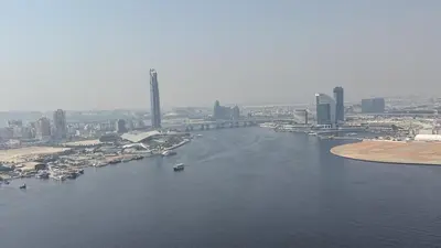 an aerial view of a river with a city at Luxury 2BHK & Lagoon view in Dubai