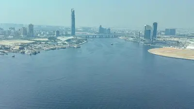 an aerial view of a river with a city at Luxury 2BHK & Lagoon view in Dubai