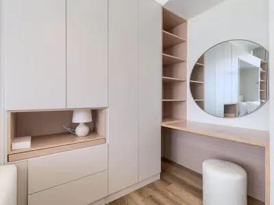 a dressing room with a mirror and a stool at TRPS - Carson Tower B, DAMAC Hills - Brand New Luxury Studio Apartment in Dubai