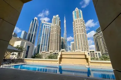 a view of a city skyline from a swimming pool at Downtown Luxury Large Studio Near Burj Khalifa with City Views, - Claren Tower 1, Downtown Dubai by Deluxe Holiday Homes in Dubai