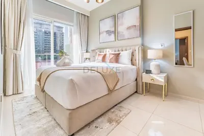 a bedroom with a large bed and a window at City and Burj Khalifa View 2BR, Near Dubai Water Canal, Vera Tower, Business Bay by Deluxe Holiday Homes in Dubai