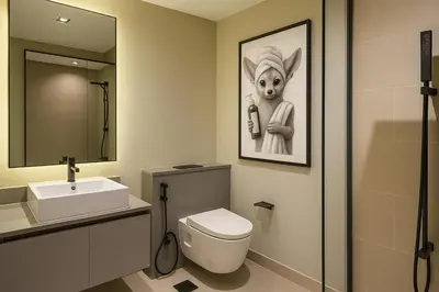 a bathroom with a rabbit painting on the wall at Sleek New Studio in Meydan, Fully Equipped and Spacious in Dubai