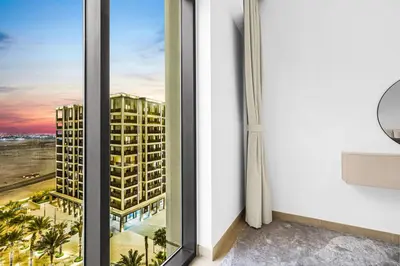 a room with a view of a building at Family 2BR Near Creek, Shops, Dining & Top Attractions in Dubai