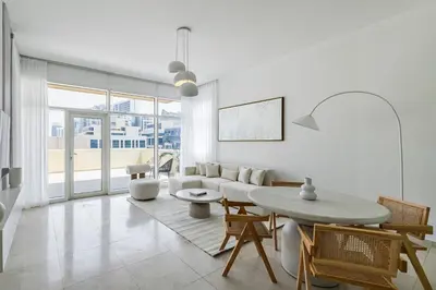 a living room with a couch and a table at 1BR plus Extra Bedroom Bay Square B7, City View in Dubai