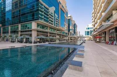 a swimming pool in the middle of a building at 1BR plus Extra Bedroom Bay Square B7, City View in Dubai