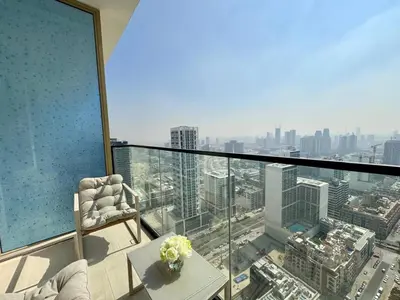 a room with a view of a city from a building at Cozy 1br With Elegant Interiors! in Dubai