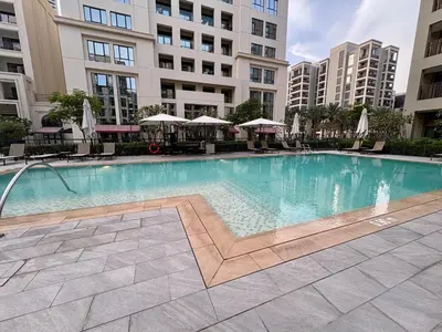 a large swimming pool in the middle of a building at FIRST CLASS 2BR Design Meets Comfort in Dubai
