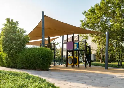 a playground with a canopy in a park at Modern Cozy Studio in Dubai