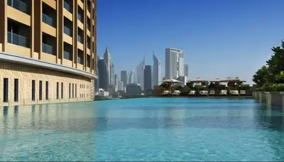 a large body of water in front of a city at FIRST CLASS Studio Stunning Burj Khalifa Views in Dubai