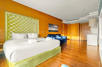 a large bedroom with a large bed and a couch at FIRST CLASS Studio Stunning Burj Khalifa Views in Dubai