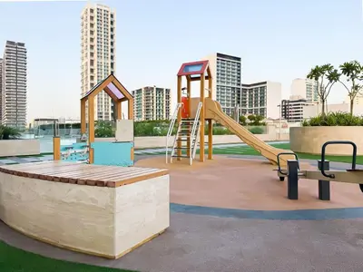 a playground with a slide and a slide at Onyx 1BR with Stunning City Views in Dubai