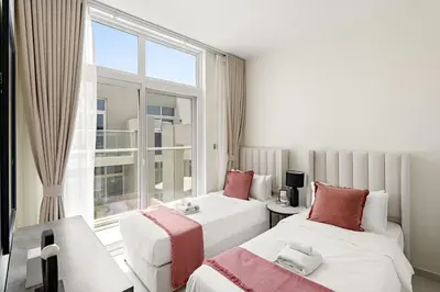 a hotel room with two beds and a window at Tranquil 3BR Villa with Malibu Beach Access in Dubai