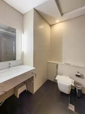 a bathroom with a sink and a toilet at Nasma Luxury stays - Executive stay in the Heart of Dubai Financial Hub in Dubai