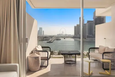 a living room with a view of the water at Sea View 2BDR Apartment, Pool and Beach Access in Dubai