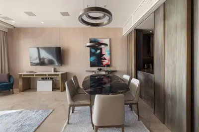 a dining room with a table and chairs at Sea View 2BDR Apartment, Pool and Beach Access in Dubai
