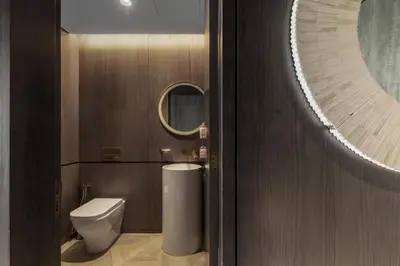 a bathroom with a toilet and a mirror at Sea View 2BDR Apartment, Pool and Beach Access in Dubai