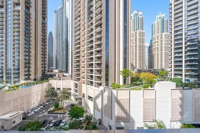 an aerial view of a city with tall buildings at Stylish 2BR with Pool, Gym, Sauna & Kid's Playground in Dubai