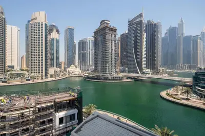 a view of a city with a river and buildings at Frank Porter - Time Place Tower in Dubai