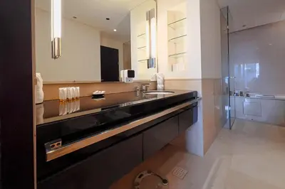 a large bathroom with a sink and a mirror at Modern 1-Bedroom in Address Marina, City View - 20AB01 in Dubai