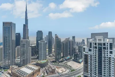 an aerial view of a city with tall buildings at Panoramic Burj Views, Famous Infinity Pool, Balcony Mini Golf - Paramount Midtown in Dubai