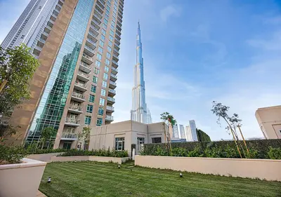 a view of the spire of a building in a city at Livin' Holidays - 2 BR - Burj Khalifa & Fountain in Dubai