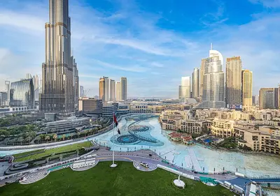 an aerial view of a city with tall buildings at Livin' Holidays - 2 BR - Burj Khalifa & Fountain in Dubai