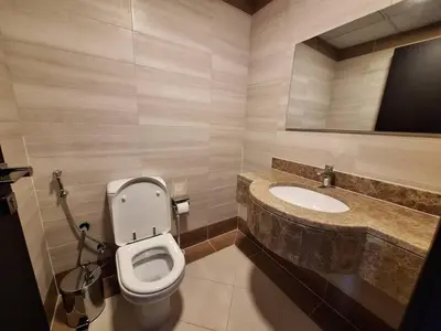 a bathroom with a toilet and a sink at Ayla Residence 1 in Dubai
