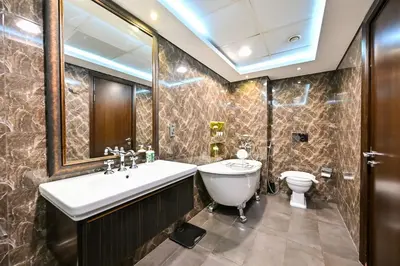 a bathroom with a sink and a toilet at The Lofts East Unique 1BR Boulevard Views close to Dubai Mall in Dubai