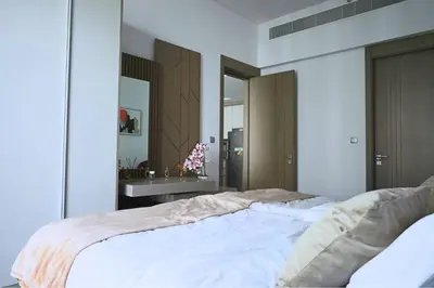 a bedroom with a large bed and a sink at Cozy 1BR Apt in Bluebell Residences,JVC in Dubai