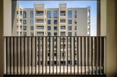 a view of a building from a balcony at Bright and Stylish 2BD at Creek Beach, Sleeps 4 in Dubai