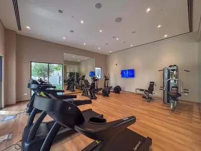 a gym with several exercise bikes in a room at Frank Porter - Groove 1 at Creek Beach in Dubai