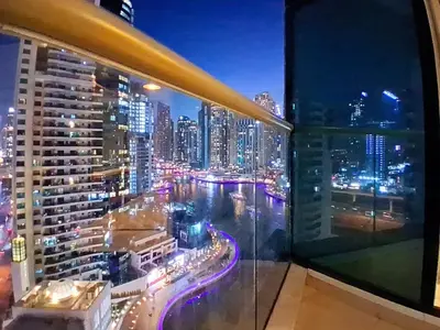 a view of a city at night from a building at Trident Bayside - Beautiful Two Bed in the Marina in Dubai