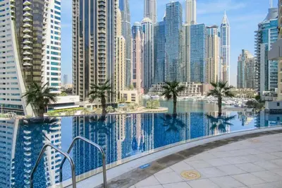 a swimming pool in a city with tall buildings at Trident Bayside - Beautiful Two Bed in the Marina in Dubai