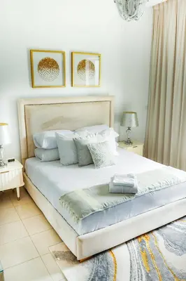a bedroom with a large white bed with pillows at Full Marina view, mins to JBR beach, Ain Dubai, Palm in Dubai
