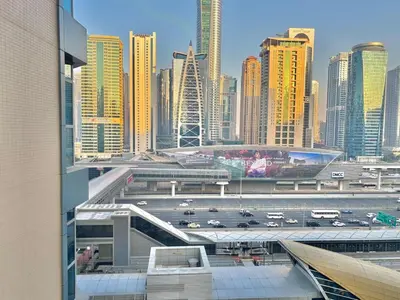 a view of a city with a highway and buildings at Dubai Marina Luxury 2BR with Pool, Gym & Near JBR Beach, Metro in Dubai