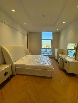 a large bedroom with a bed and a window at 5 Star Luxury 3BR Apartment on The Palm with Huge Pool and Beach in Dubai