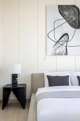 a bedroom with a bed and a picture on the wall at Frank Porter - Murooj Al Furjan West in Dubai