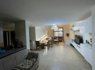 a large living room with a dining room and a kitchen at Luxury hub in Dubai